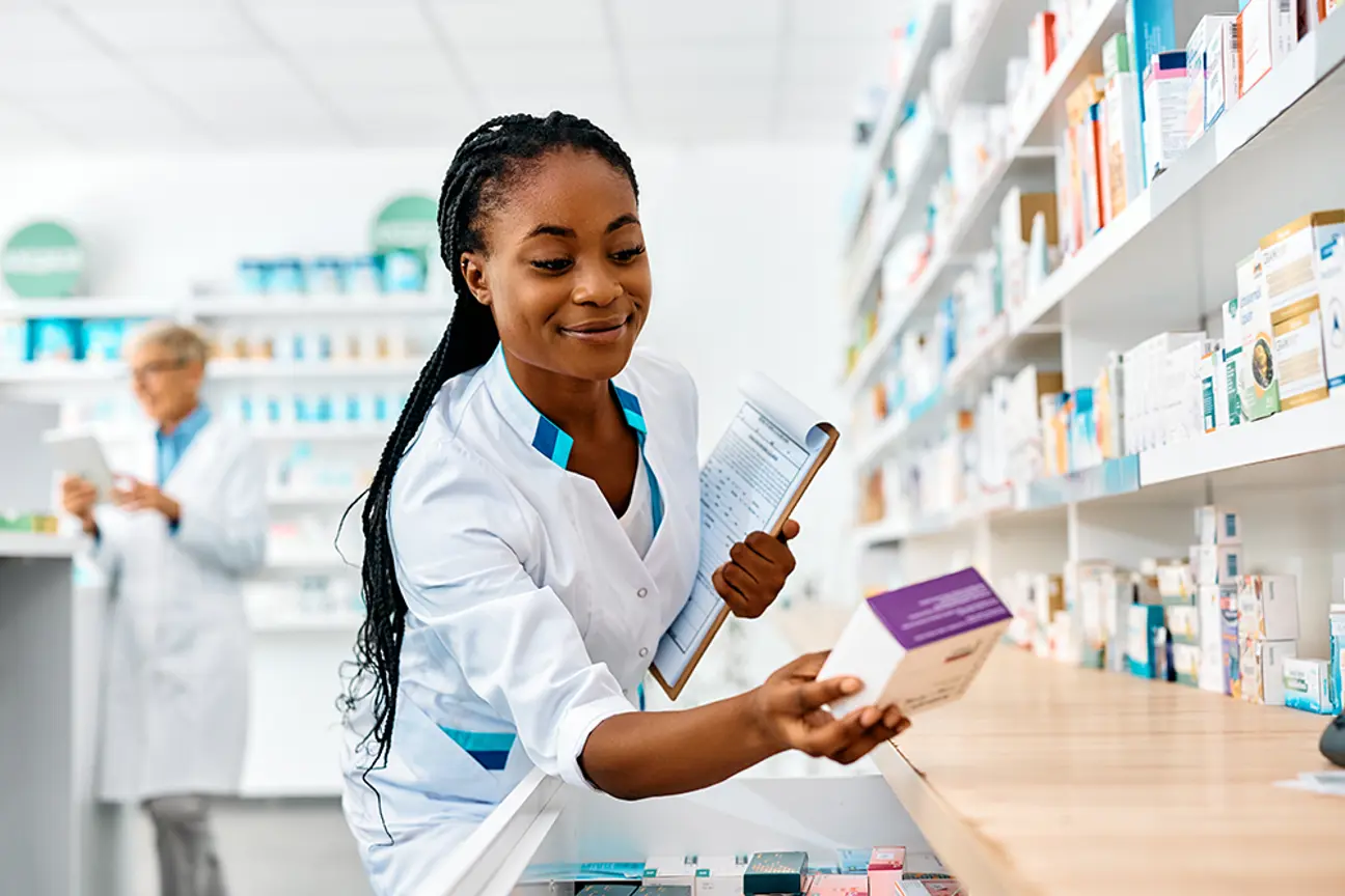 young-smiling-black-pharmacist-going-through-inven-2026-01-06-10-29-57-utc.png