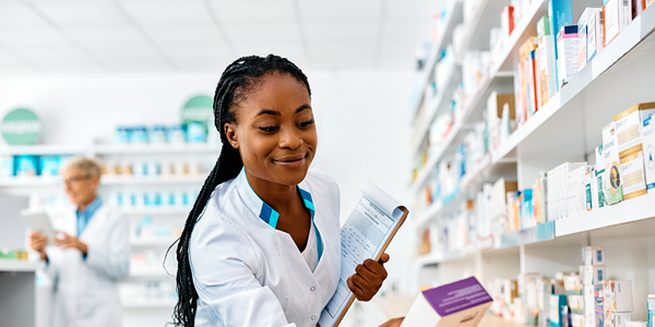 young-smiling-black-pharmacist-going-through-inven-2026-01-06-10-29-57-utc.png