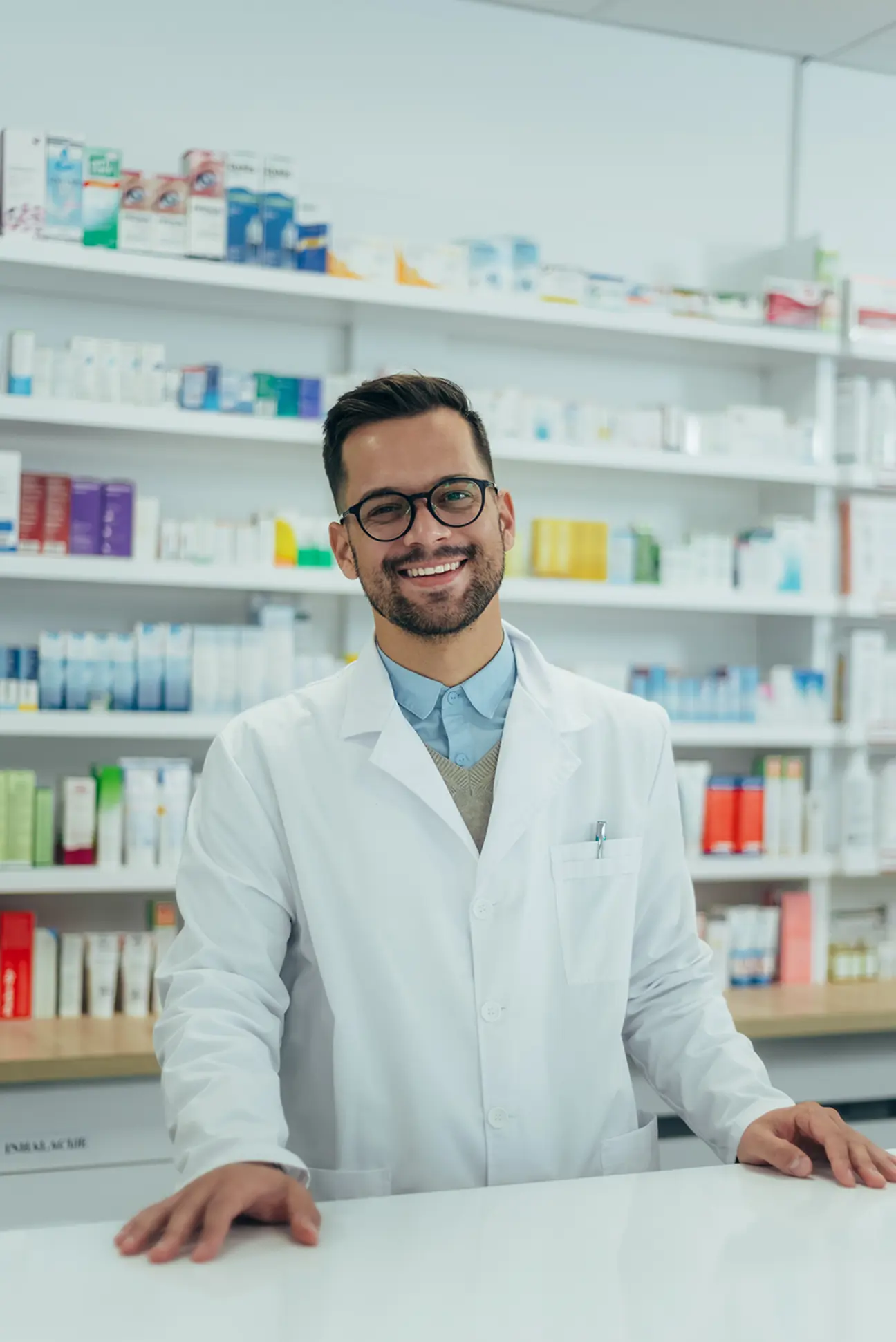 portrait-of-a-handsome-pharmacist-working-in-a-pha-2026-01-09-09-19-54-utc.png